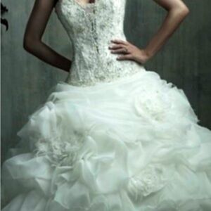 Allure couture wedding gown with Souveraski crystals and feather flowers.
